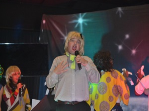 team member signing karaoke